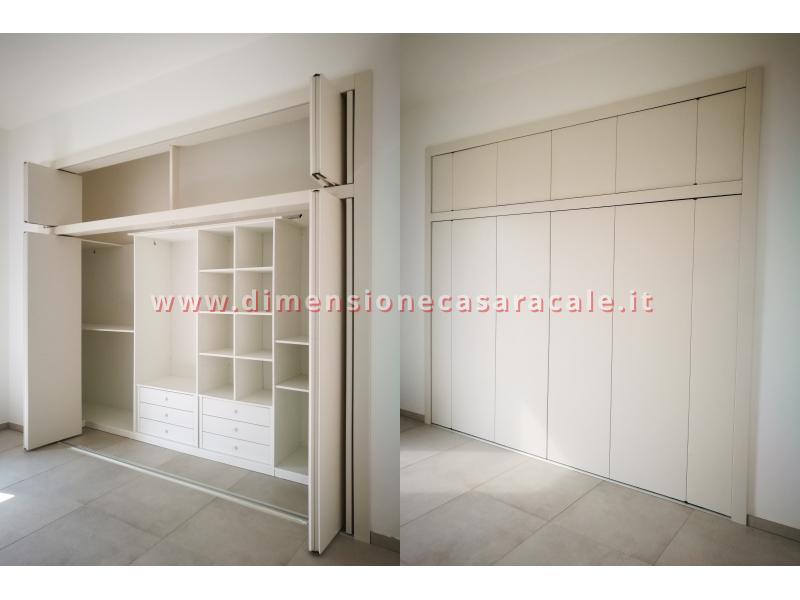 Realizzazione e installazione di cabina armadio in legno su misura con laccatura bianca 8 8